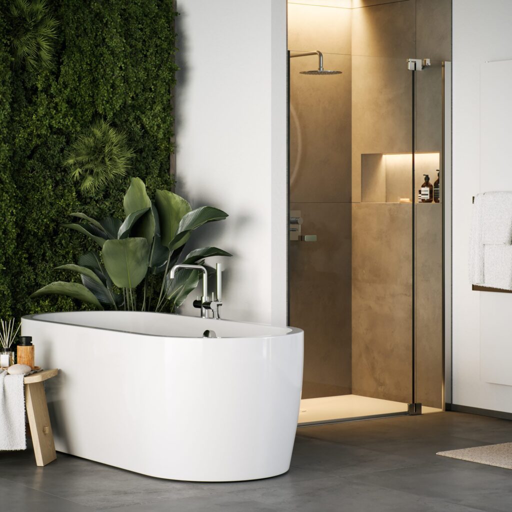 Modernes Badezimmer mit freistehender Badewanne vor grüner Pflanzenwand, bodengleicher Dusche in Natursteinoptik und stilvollen Accessoires – concept 300 Serie in Spa-Atmosphäre.